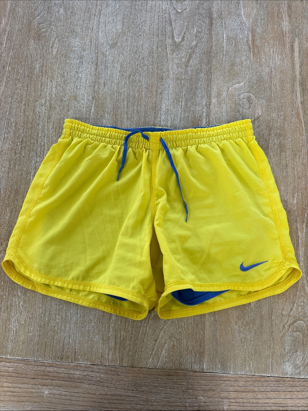 Nike Women’s Yellow Athletic Shorts with Blue Accents